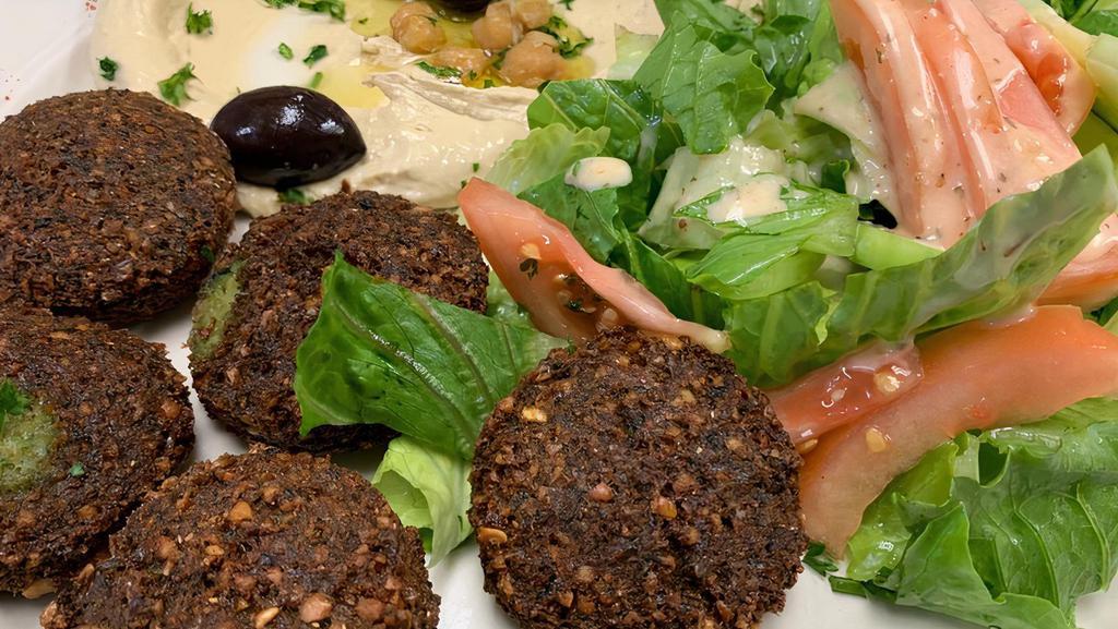 Falafel Plate · Ground chick peas, onions, parsley and garlic, blended with seasoned and fried to perfection.