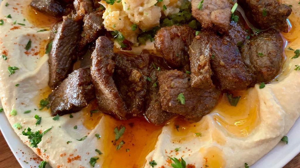 Hummus With Lamb · Fresh lamb with fresh served over a bed of hummus.