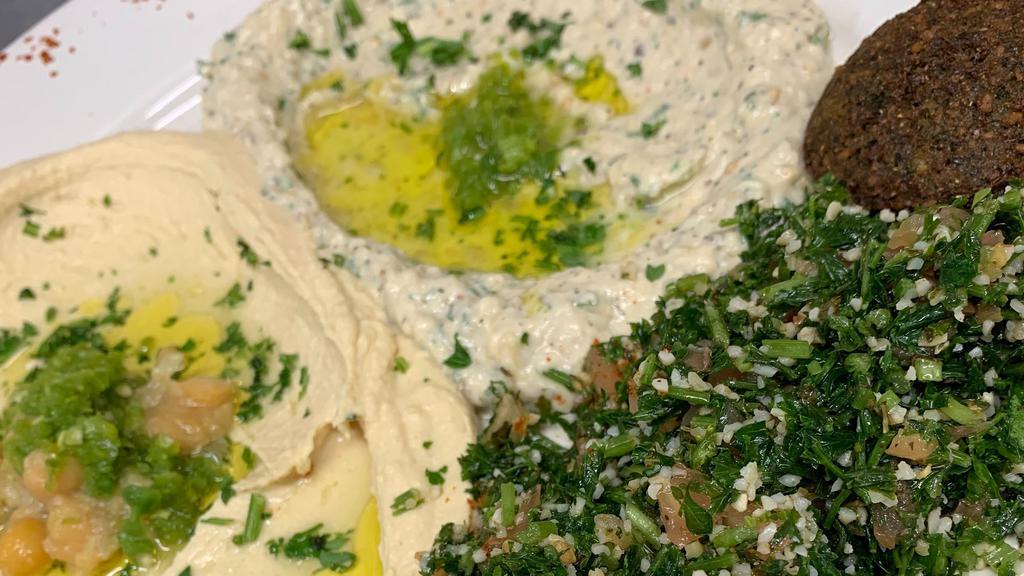 Vegetarian Plate · Tabouleh, hummus, baba ganuj and falafel.