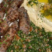 Shish Kufta · 2 skewers of grilled ground lamb with parsley, and spices.