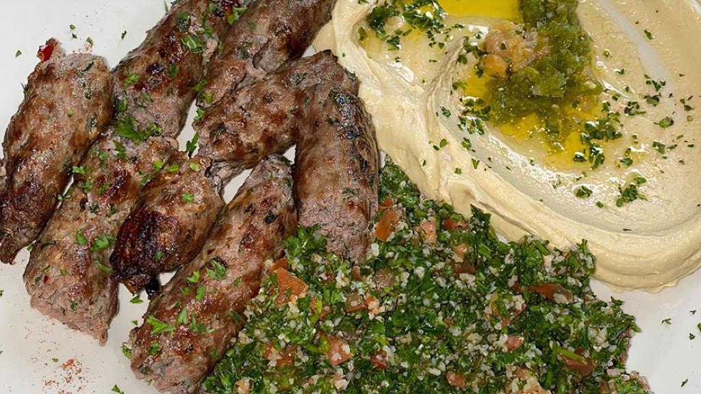 Shish Kufta · 2 skewers of grilled ground lamb with parsley, and spices.