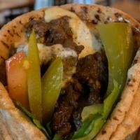 Beef Shawarma Sandwich · Marinated slices of beef blended with middle eastern spices.