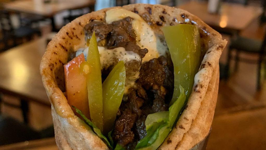 Beef Shawarma Sandwich · Marinated slices of beef blended with middle eastern spices.
