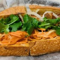 Banh Mi - Pork Belly Combo · Come with pork belly banh mi, fries, and soda can. Baguette filled with pork belly. Garnishe...