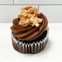 German Chocolate Cupcake · Chocolate cake filled with caramel, pecan, coconut German filling and topped with chocolate ...