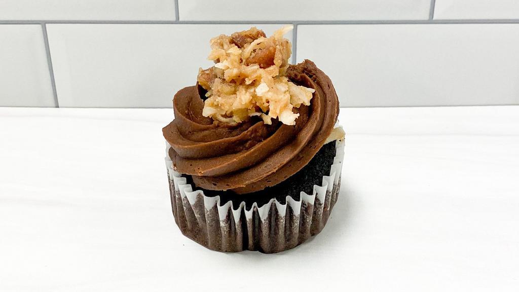 German Chocolate Cupcake · Chocolate cake filled with caramel, pecan, coconut German filling and topped with chocolate fudge icing and even more German filling