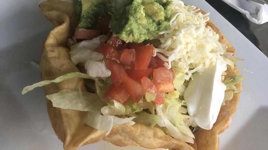 Taco Salad Lunch · Crispy flour shell filled with shredded chicken or ground beef, beans, lettuce, tomato, sour cream, and guacamole.
