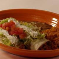 On The Border · One chicken enchilada, one chicken burrito topped with cheese dip, lettuce, tomato, and sour...