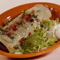 Burrito Toro Loco · A beef or chicken burrito with cheese dip. Topped with lettuce, tomato, sour cream, and guac...