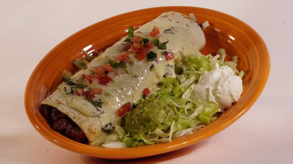 Burrito Toro Loco · A beef or chicken burrito with cheese dip. Topped with lettuce, tomato, sour cream, and guacamole.