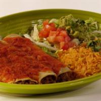 Enchiladas Rancheras · Three chicken enchiladas topped with ranchera sauce. Served with rice and guacamole salad.