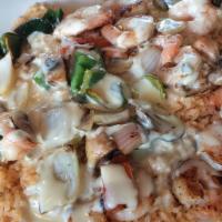 Arroz Con Camaron · Tender shrimp grilled with mushrooms, onions, and poblano pepper. Served on a bed of rice an...