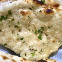 Garlic Naan · Plain Naan, infused with garlic and brushed with butter