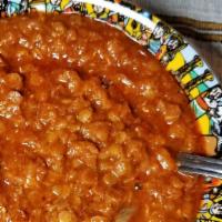 Yemisir Kik Wat · Split red lentils cooked with berbere herbs, sauce, onions, and spices.