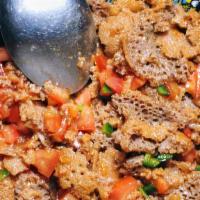 Tomato Fitfit · Diced tomato, onion, jalapeno peppers & spices mixed with pieces of injera.