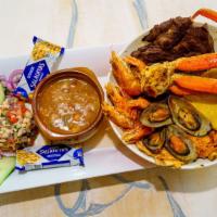 Parrillada Mar Y Tierra · Grilled chicken, steak, crab, chorizo, tilapia filet, shrimp mussels, ceviche, rice, charro ...