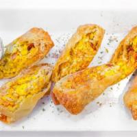 Breakfast Eggrolls · Stuffed with egg, cheese, hash browns,  bacon and sausage. Served with our sour cream white ...
