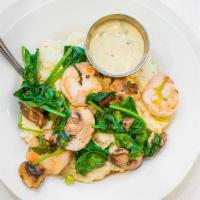 Shrimp N Grits  · A poached egg tops off our creamy smoked gouda grits with shrimp and sautéed with garlic and...