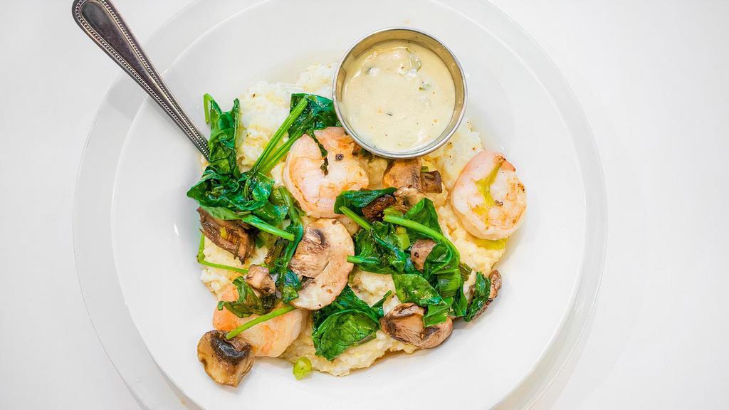 Shrimp N Grits · A poached egg tops off our creamy smoked gouda grits with shrimp and sautéed with garlic and mushrooms, spinach, and scallions. This double portion of grits does not include an additional side.