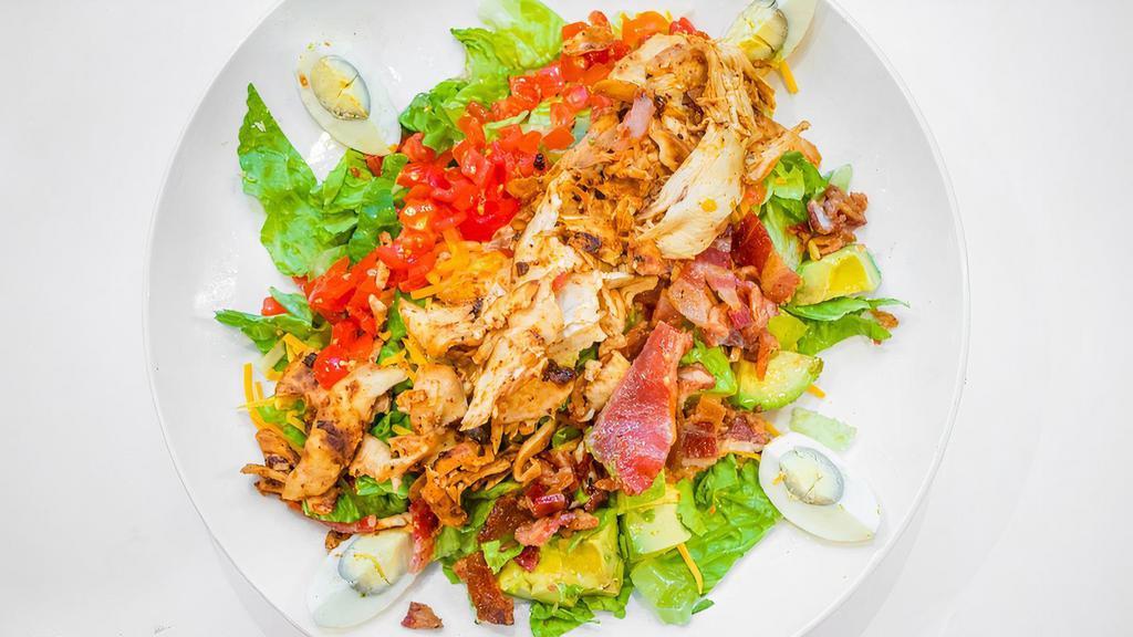 Cobb Salad · The classic grilled chicken, egg, bacon, tomato, avocado, and cheddar .