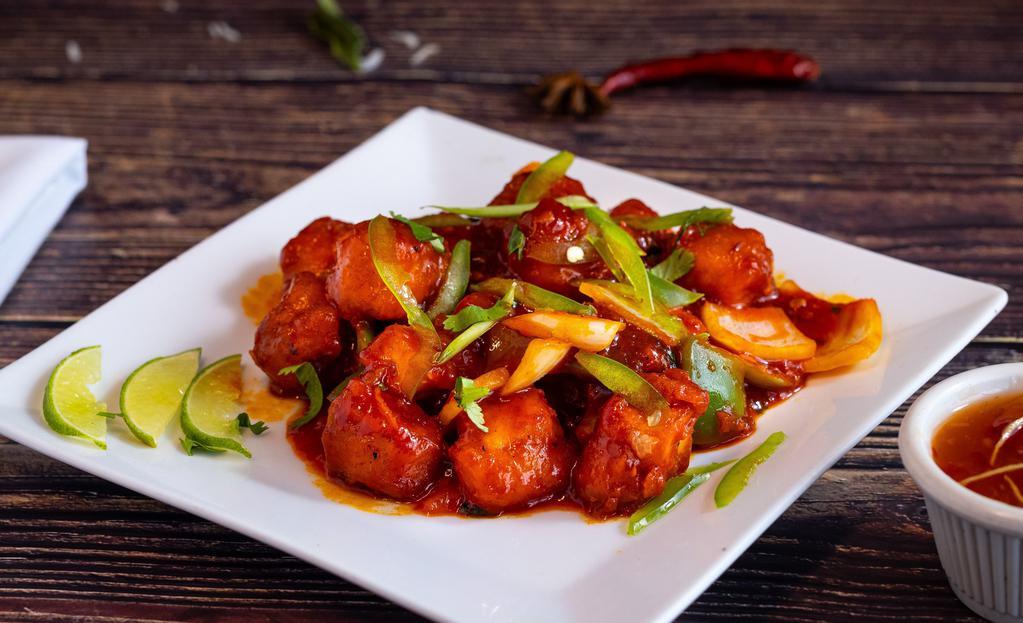 Veg Chilli Appetizers · An Indo Chinese fusion dish, it is crispy, and has a spicy, sweet and sour taste. Baby corn/Cauliflower/Paneer coated with batter, deep fried and tossed soy sauce, sweet red chilli sauce, salt and pepper. Served with stir fried spring onions and  green bell peppers,