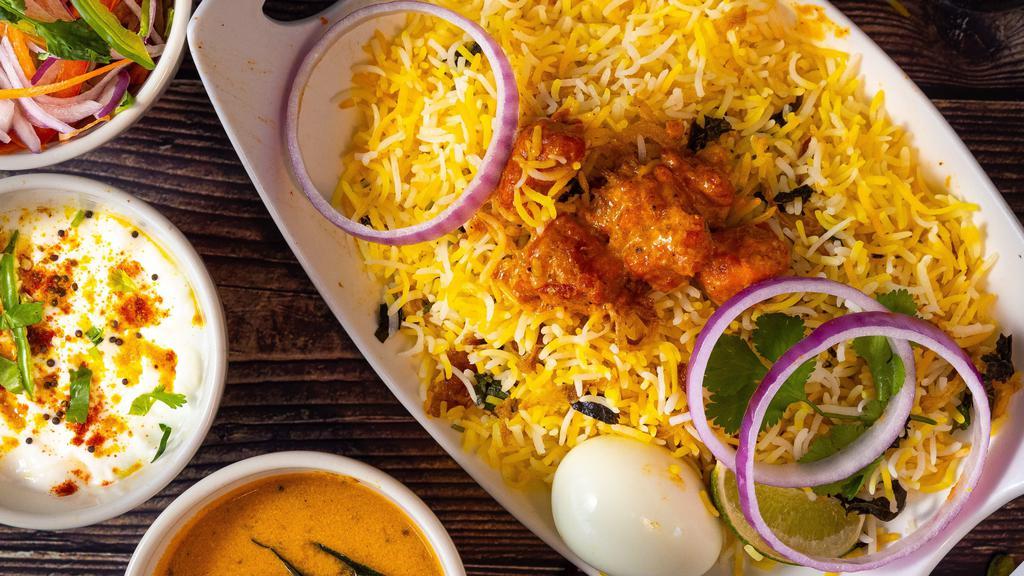 Non-Veg Biryanis · Basmati rice cooked with choice of meat, blended with herbs and spices, and then garnished with onion and lemon. Served with Yogurt raita and Mirchi ka salan.