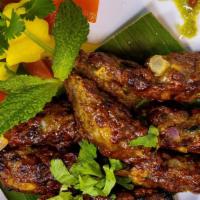 Seekh Kebab · Minced lamb mixed with onions and spices cooked in a clay oven.