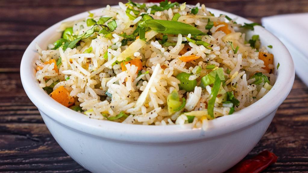 Veg Fried Rice · Wok stir-fried cooked rice with loads of veggies blended with sauces and tossed with various indian spices