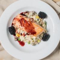 Blackberry Salmon · Pan seared salmon, cous cous and haricot vert, blackberry, fig reduction.