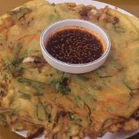 Haemul Pajeon · Korean style pancake with assorted seafood and green onions.