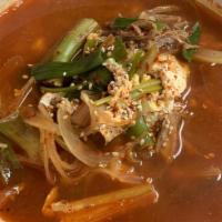 Yukgaejang · Spicy beef soup with shredded beef flank, noodles, green onions,onions and egg.