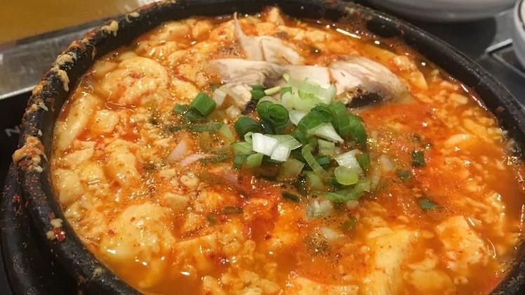 Soondubu · Spicy soft tofu stew with onions, mushroom and green onions.