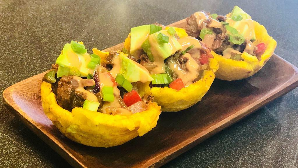 Tostones Rellenos · Cup shaped fried plantains stuffed with chicken, beef, shrimp or veggies.