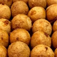 Bolas De Yuca / Fried Yuca Balls · Enjoy our cheese stuffed, deep fried yuca balls.
