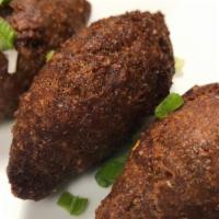 Quipes · Dominican-Lebanese inspired fried wheat and beef croquettes (three pieces per order).