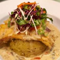 Pescado Al Coco / Sauteed Coconut Fish · White fish fillet grilled and sauteed in a coconut cream sauce and veggies served with salad...