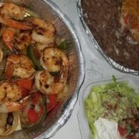 Grilled Shrimp Fajitas · A delicious portion of grilled juicy shrimp.

*May be cooked to order. Consuming raw or unde...