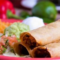 Mexican Taquitos · Three lightly fried rolled corn tortillas, filled with chicken or shredded beef. Served with...