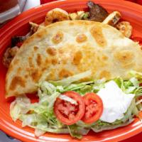 Fajita Quesadilla · Chicken strips with grilled onions, peppers and melted cheese.