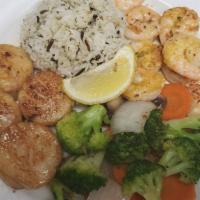Grilled Scallops And Shrimp · Served with white rice and sautéed mixed veggies.