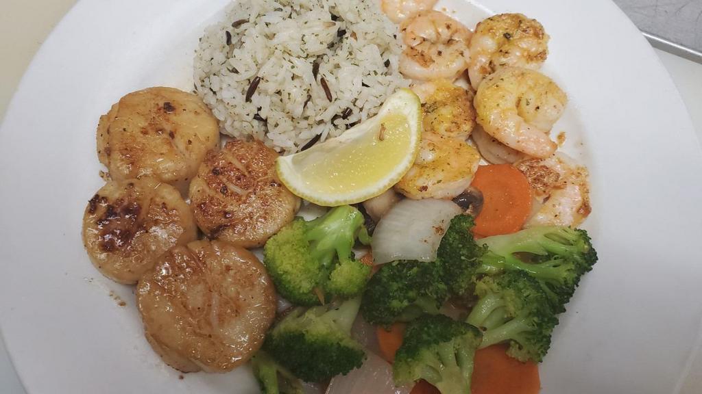 Grilled Scallops And Shrimp · Served with white rice and sautéed mixed veggies.