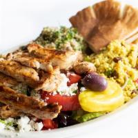 Trio Grilled Chicken Salad · Marinated, grilled chicken over a Greek salad with moroccan couscous and tabouli salad - ser...