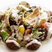 Falafel Salad · Falafel served over a bed of fattoush salad with tahini sauce, croutons, and pepperoncini.