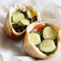 Grape Leaves Sandwich · Homemade  grape leaves stuffed with rice, tomato, and fresh mint, in a pita with labneh, cuc...