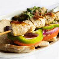 Chicken Souvlaki Platter · Chicken breast marinated in spices and white wine vinegar, skewered, and grilled.