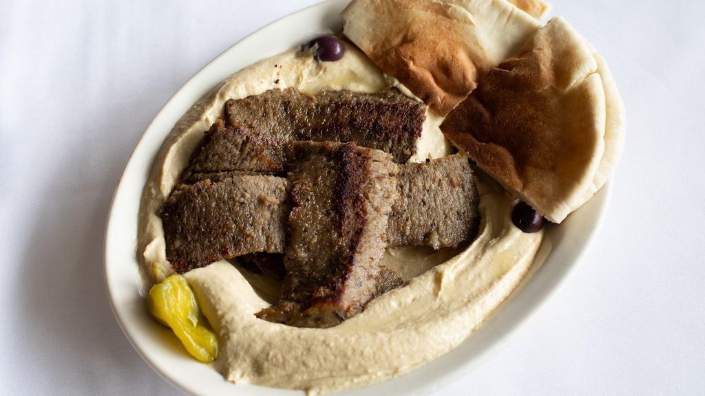 Hummus & Gyro Platter · A generous bed of hummus, topped with lamb and beef gyro meat, sprinkled with olive oil.