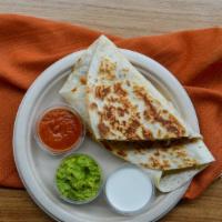 Grande Quesadilla · Twelve inches. Braised chicken, Chihuahua cheese, refried beans, with side chipotle salsa, c...