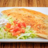 Quesadilla Fajita Grande · Large flour tortilla stuffed with cheese and your choice of chicken or steak. Cooked with on...