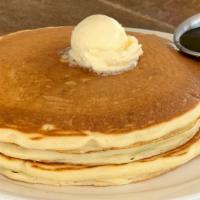 Buttermilk Pancakes · Vegetarian. Stack of three fluffy buttermilk pancakes served with whipped butter and real ma...