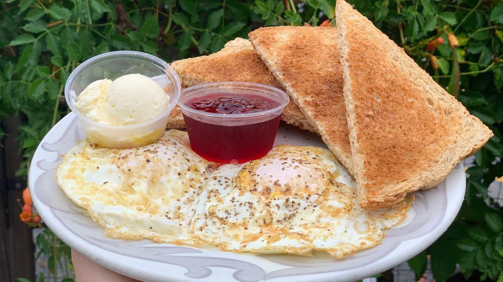 Two Eggs & Toast · Vegetarian, gluten-free. Two farm fresh eggs any style served with whole wheat toast, butter, and homemade muscadine wine jelly.